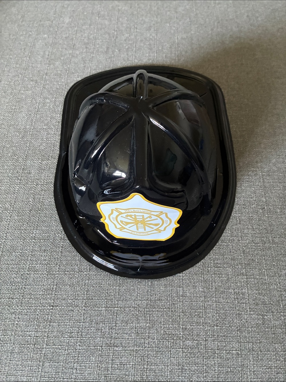 Black Toy Firefighter Helmet with Gold Badge